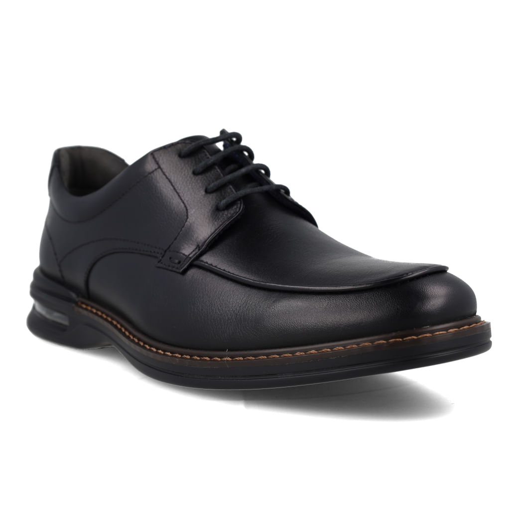 Vista lateral do sapato Democrata Air Magnum masculino preto mostrando a sola em borracha termoplástica e acabamento em couro.
