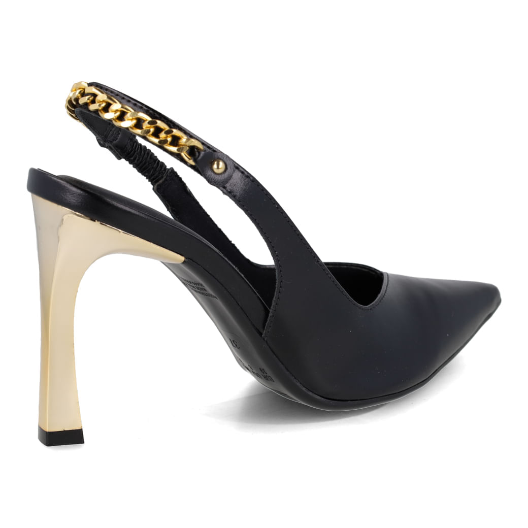 Scarpin feminino preto com salto alto e detalhes dourados, vista lateral para seção Why Buy