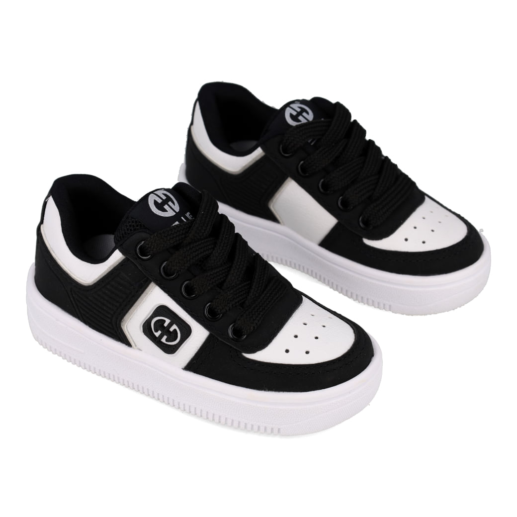 Tênis infantil Ollie ProMax preto e branco com destaque para tabela de numeração