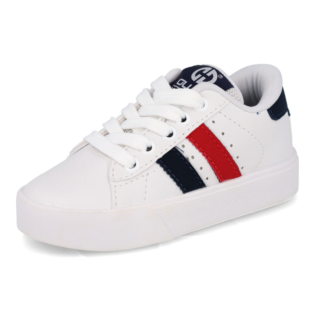 Tênis infantil branco visto de lado com detalhes vermelhos e azuis, solado flexível e design esportivo