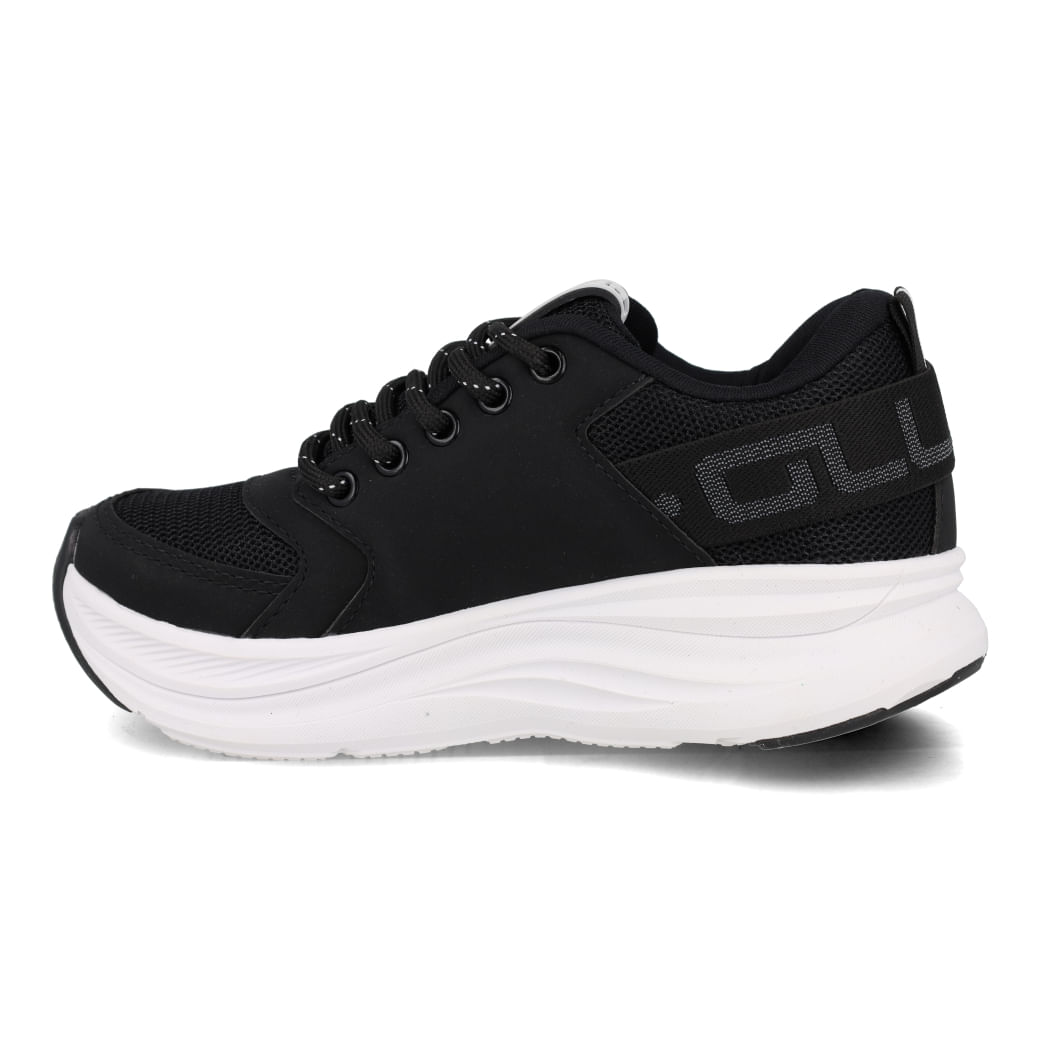 Tênis casual Ollie juvenil preto visto de lado com detalhes em branco e fechamento por cadarço