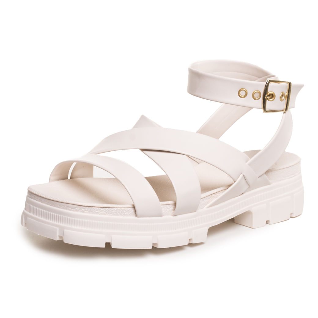 Sandália feminina Moleca branco off vista lateral com solado tratorado e tiras cruzadas.