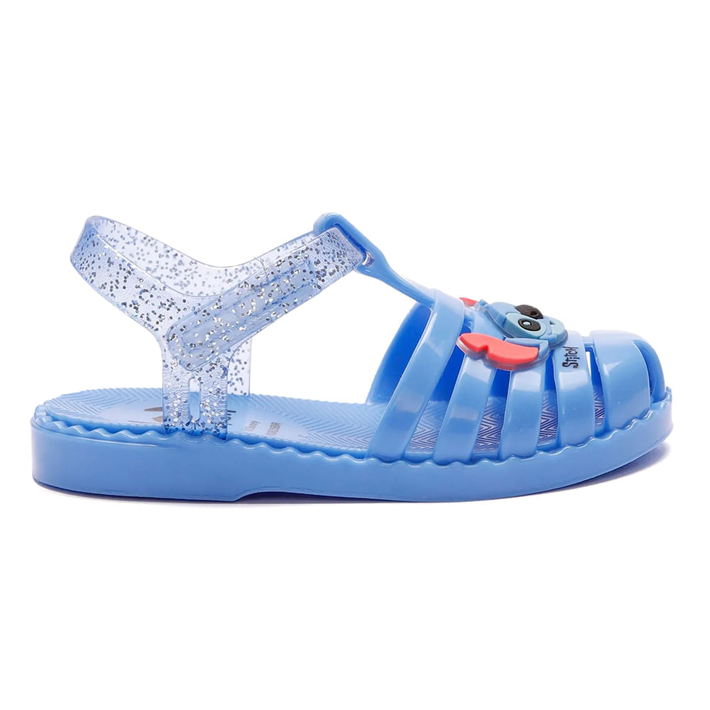 Sandália infantil azul com tiras frontais e tirante de calcanhar translúcido com glitter vista lateral direita